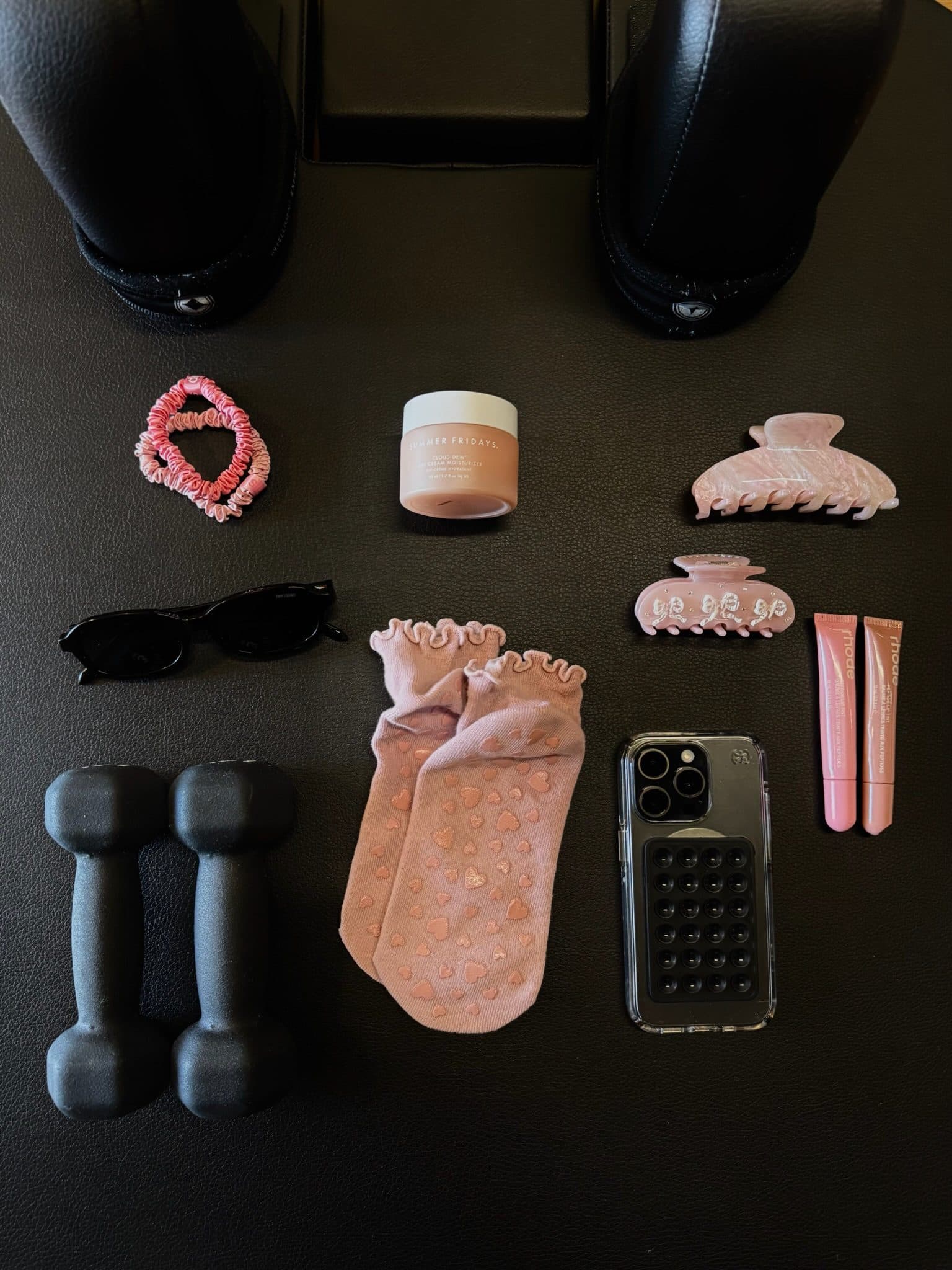 Flat lay of grip socks and class essentials on a reformer at Bodies and Pilates in North Hollywood